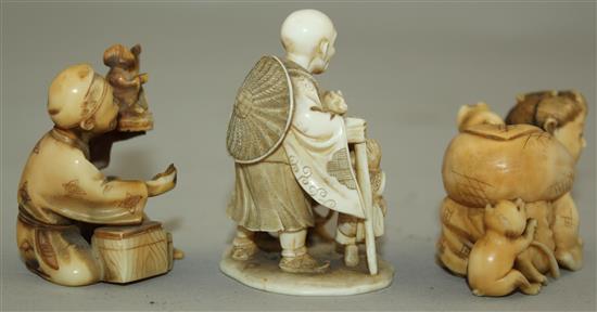 A Japanese ivory netsuke and two similar okimono